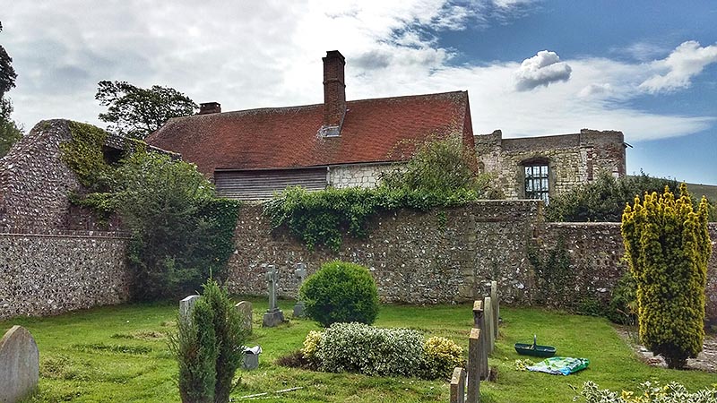 The north side of Wilmington Priory, Sussex, viewed from the adjacent churchyard