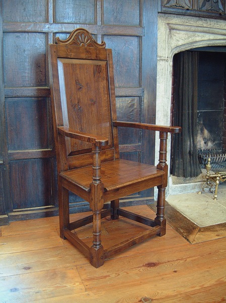 Carved cresting rail oak armchairs in the Great Hall of National Trust