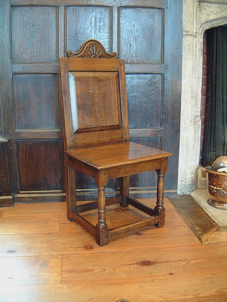 Carved oak side chair, in the Great Hall of Sutton House, a London property owned by the National Trust.