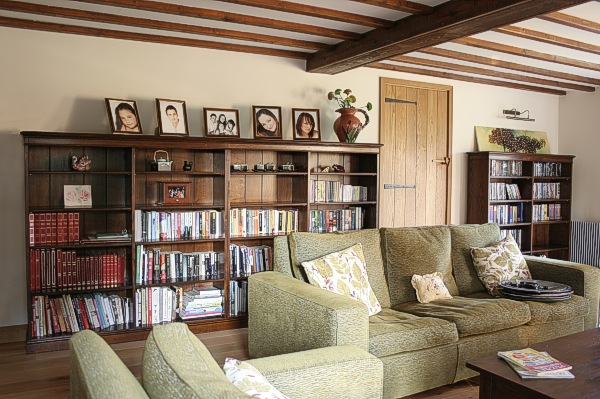 Quad length bespoke oak bookcase in Sussex country house.