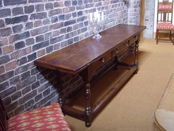 Oak folding side table in hallway doubles as dining table