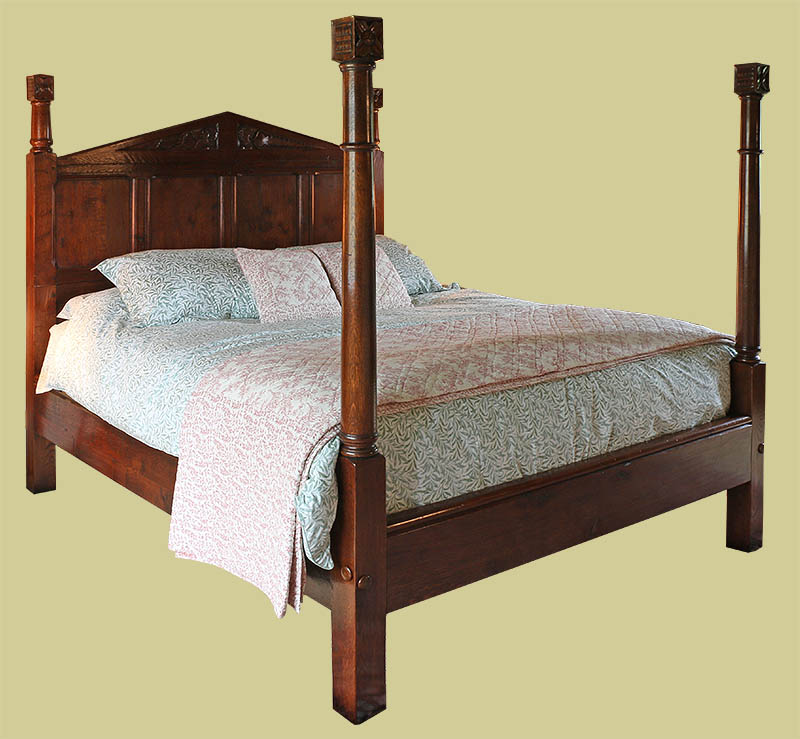 Oak panelled and carved Tudor style pencil bed