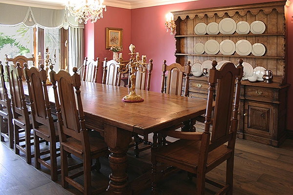 Antique style oak furniture in traditional dining room
