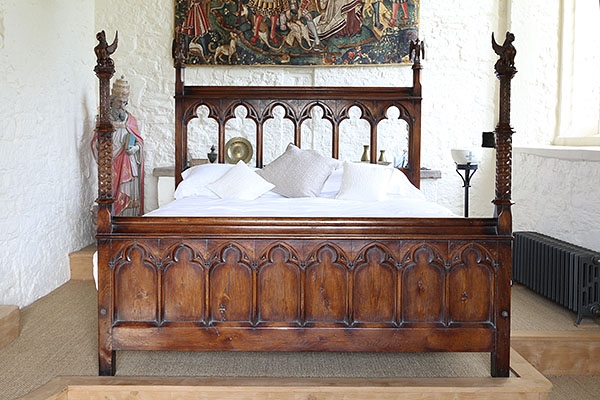 Gothic style handmade bespoke carved oak bed in C14th home