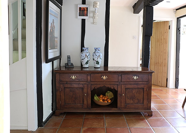 Oak dog kennel style dresser base in old Kent cottage