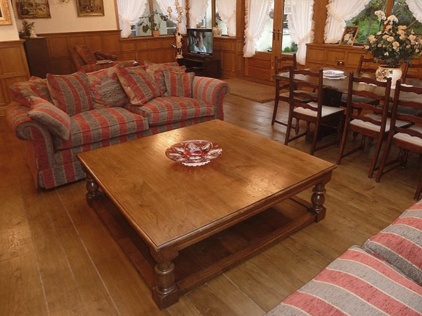 Large square oak pot board coffee table in panelled room 