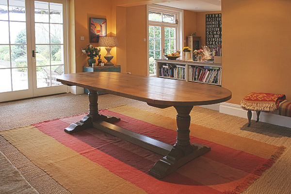 A D-end oak pedestal table, commissioned by a local Interior Designer and photographed here in their clients Sussex cottage.