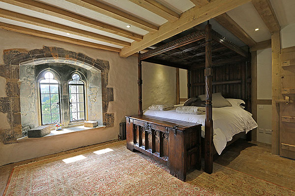 15th century style oak clamped front chest, shown here in our clients beautiful old stone built country manor house.