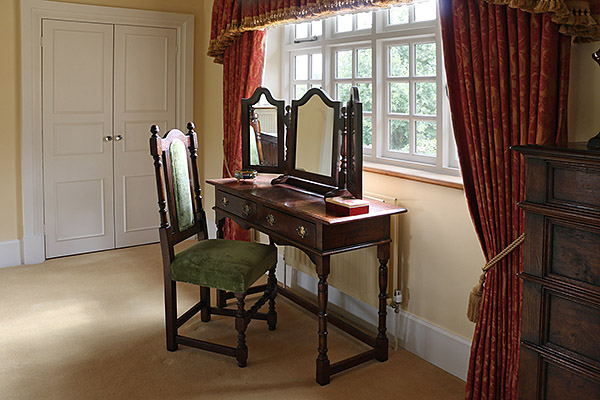 Period style oak dressing room furniture, pictured here in our clients beautiful Warwickshire country house.