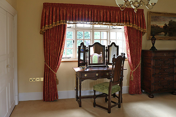 Period style oak dressing table, upholstered chair and mirror, shown here in our clients wonderful stone built Warwickshire country home.