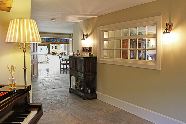 16th century style bespoke made canted oak livery cupboard, specially designed for our clients hallway.