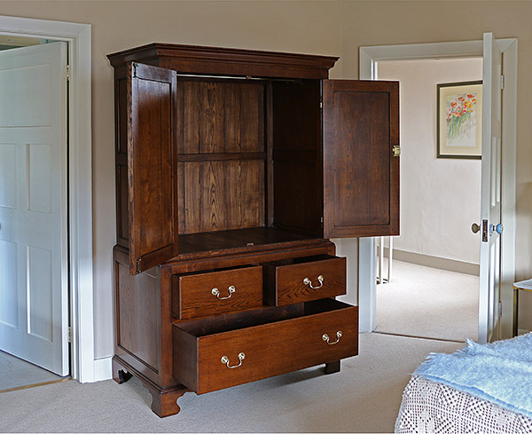 Bespoke period style oak linen press, in the master bedroom of our clients Berkshire cottage.