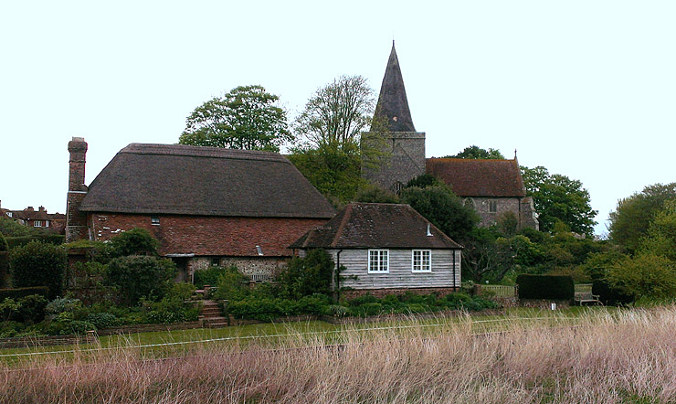 The south side of Alfriston Clergy House and St Peters church, from the River Cuckmere