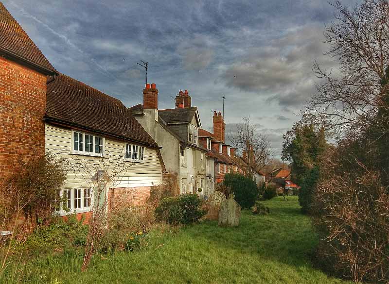 Looking eastwards, mainly 17th century cottages, facing Cowfold churchyard