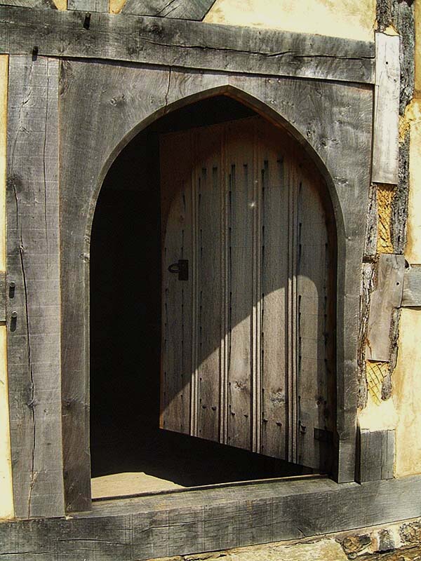 Close view of oak Medieval south door of restored barn