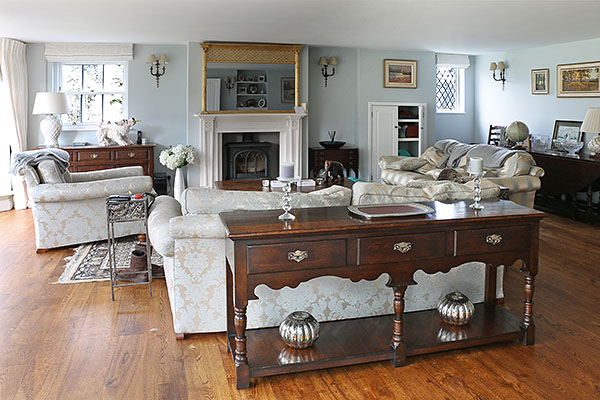 Antique style oak potboard dresser base in sitting room of Sussex farmhouse.