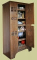 Early 16th century style boarded oak hutch, or sometimes known as an aumbry or press cupboard, used as a kitchen storage cupboard.