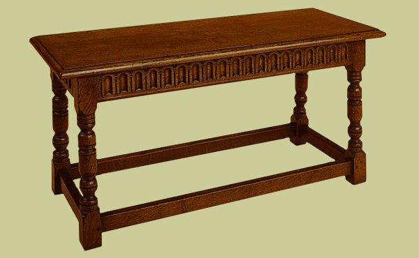 Oak four legged period style bench with hand carved thumbnail rails.