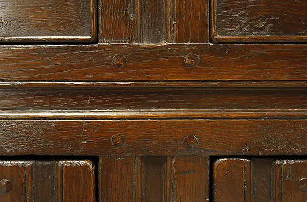 Detail of 2-door high oak dresser with open rack.