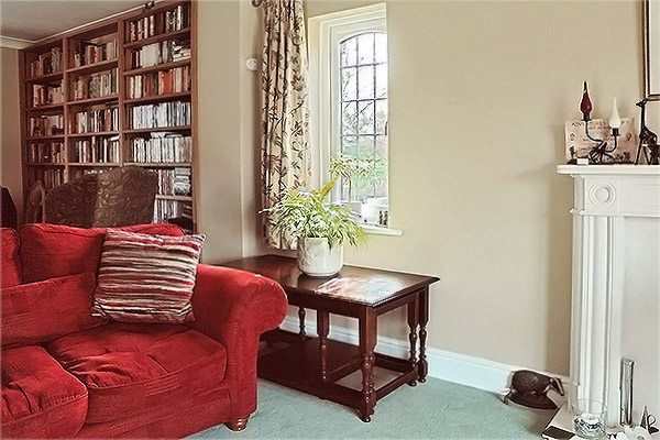 Side loading oak nest of tables, in sitting room of West Sussex home.