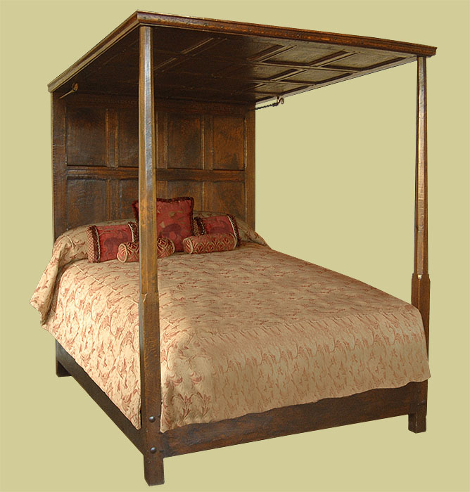 Tapered octagonal cut footpost oak panelled tester bed.