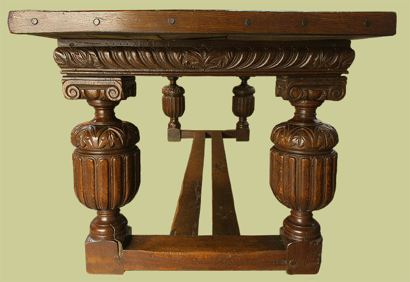 Detail of heavily carved Elizabethan style oak refectory table