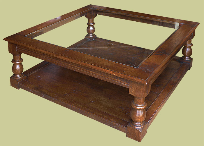 Period style large square oak coffee table with glass top.