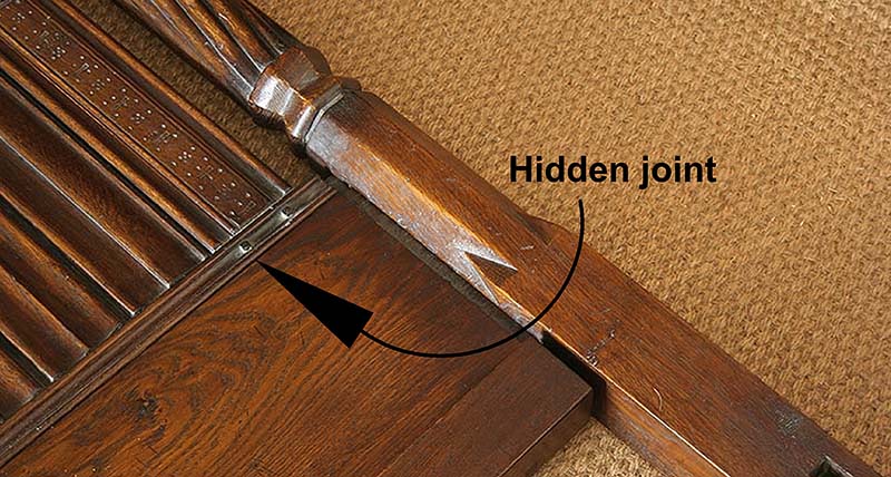 Disguised lower frame joint on hand carved four poster bed headboard assembly