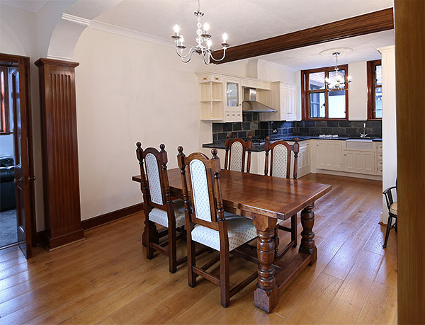 Small but chunky oak refectory table and upholstered dining chairs in Kent manor house