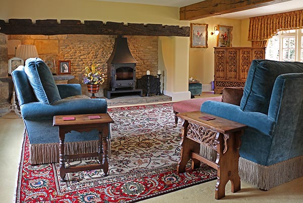 Period style oak stools in country house sitting room