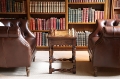 Close up view of oak games table in library of 17th century Sussex cottage