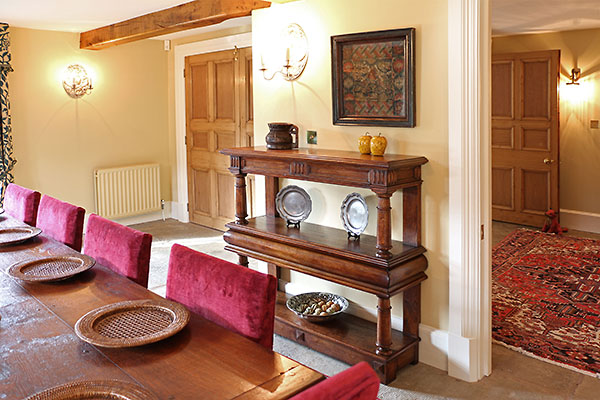 Period style court cupboard and oak dining furniture in Warwickshire country house