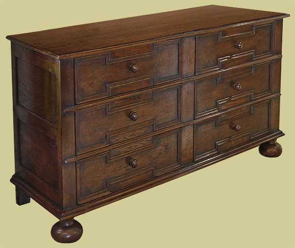 Wide 4-drawer oak Jacobean style bedside cabinet