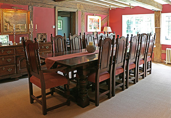 Period style oak carved table and chairs in 16th century house