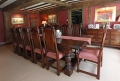 Period style oak table chairs in 16th century timber framed interior