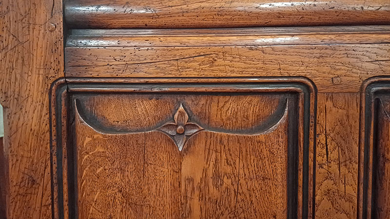 Medieval style carved oak bed panel detail