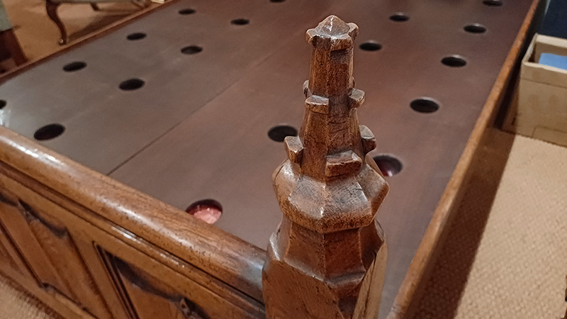 Medieval style carved oak bed footboard detail