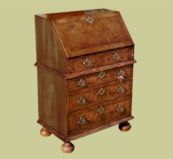 Walnut veneered traditionally styled 5-drawer bureau.